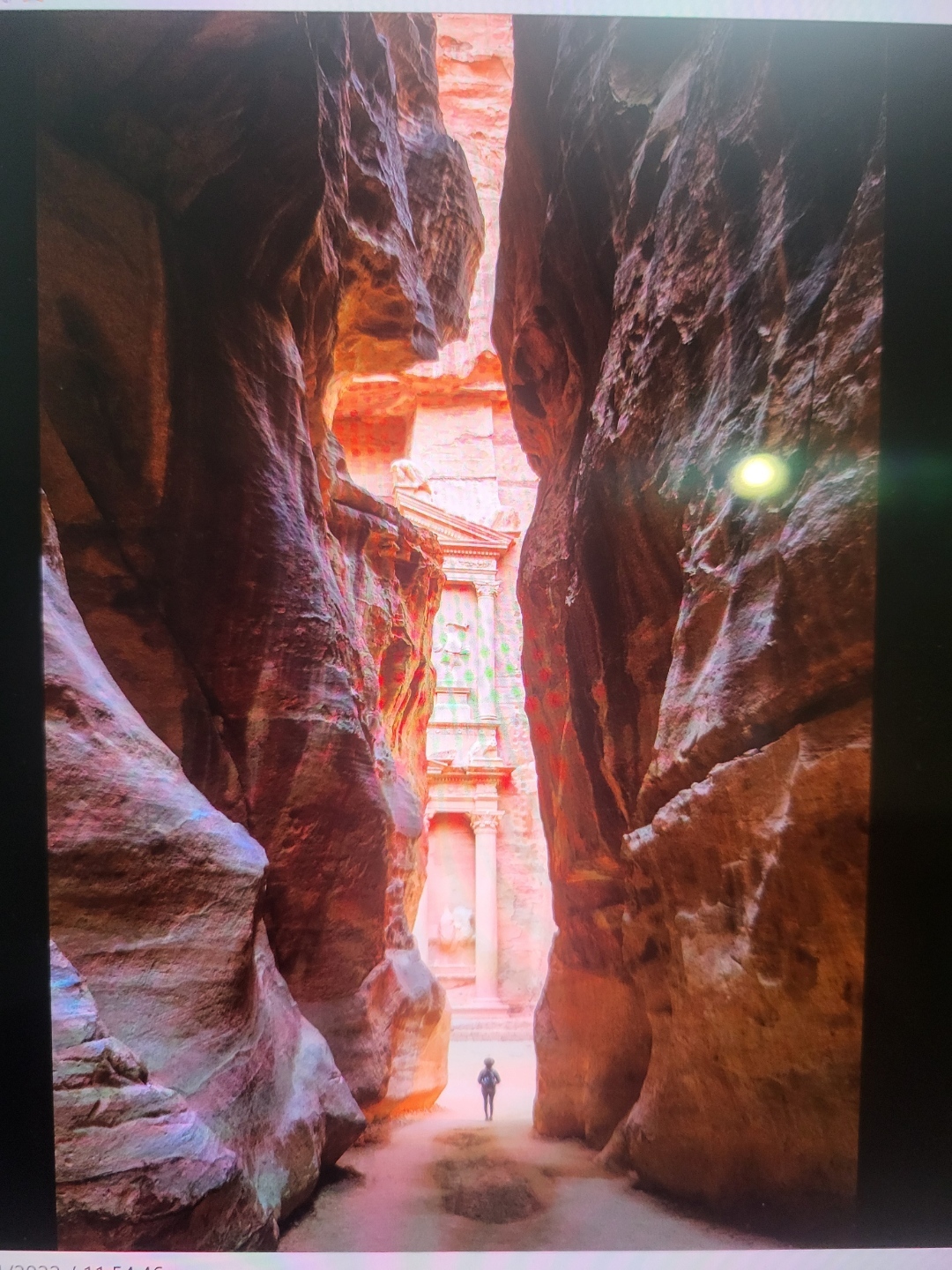 Investor walking through a narrow canyon toward long-term financial opportunity